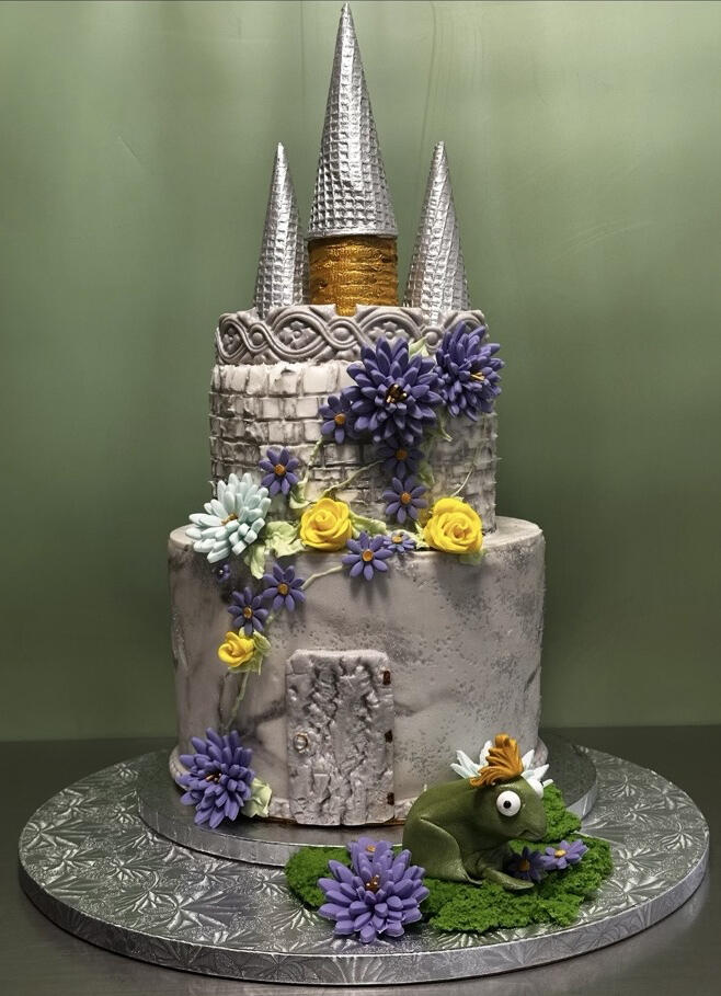 Custom Fantasy Castle Cake Custom fantasy castle cake with handcrafted flowers and sculpted details by Glenna’s Creative Cakes.